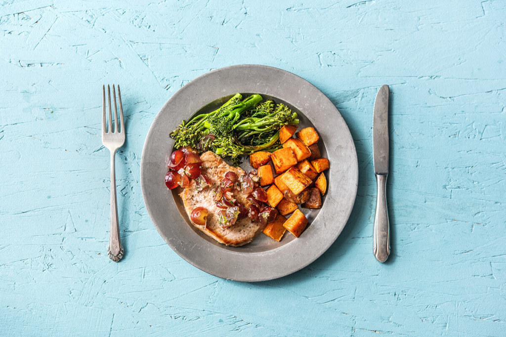 Food in plate along with knife and fog