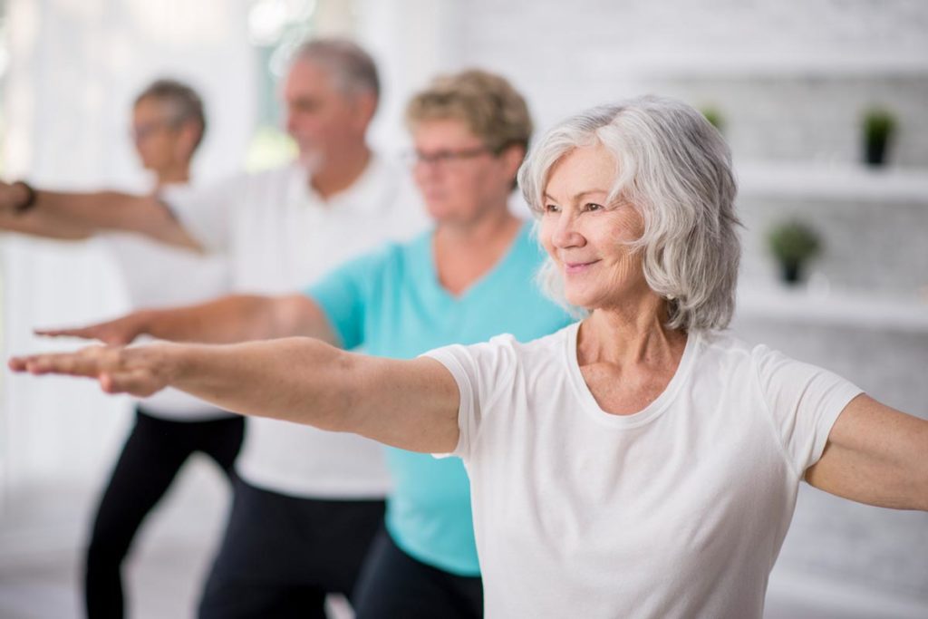 Senior Woman exercising yoga