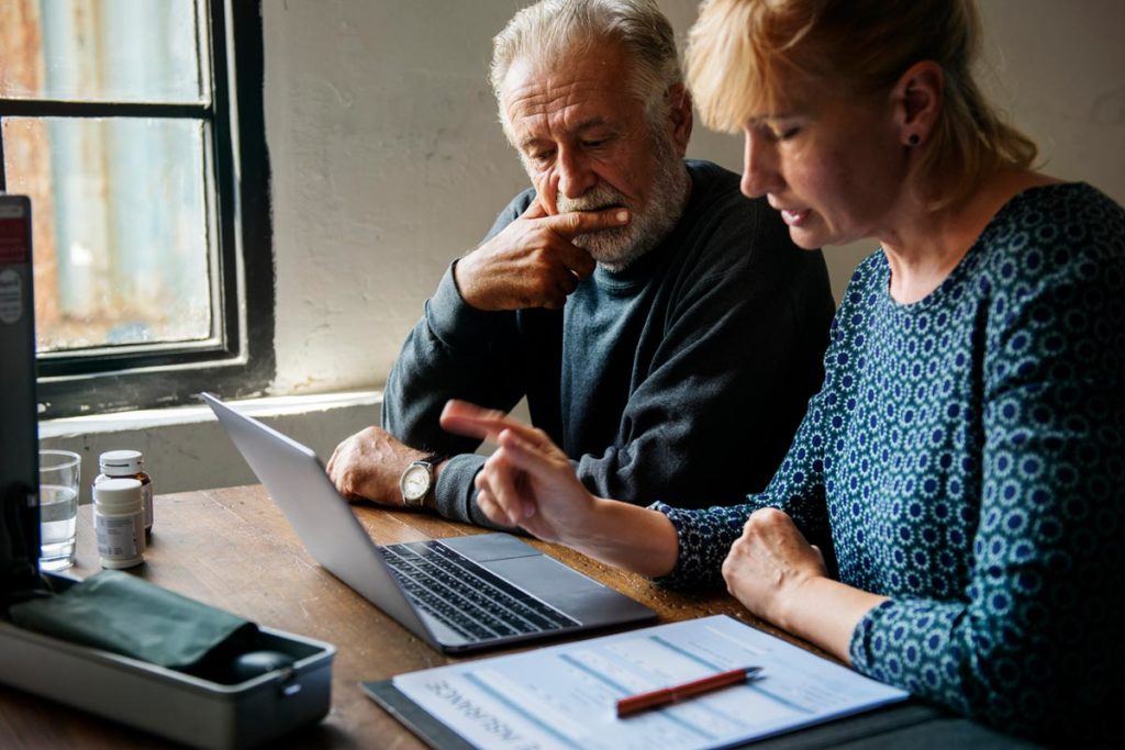 Senior couple picking life insurance