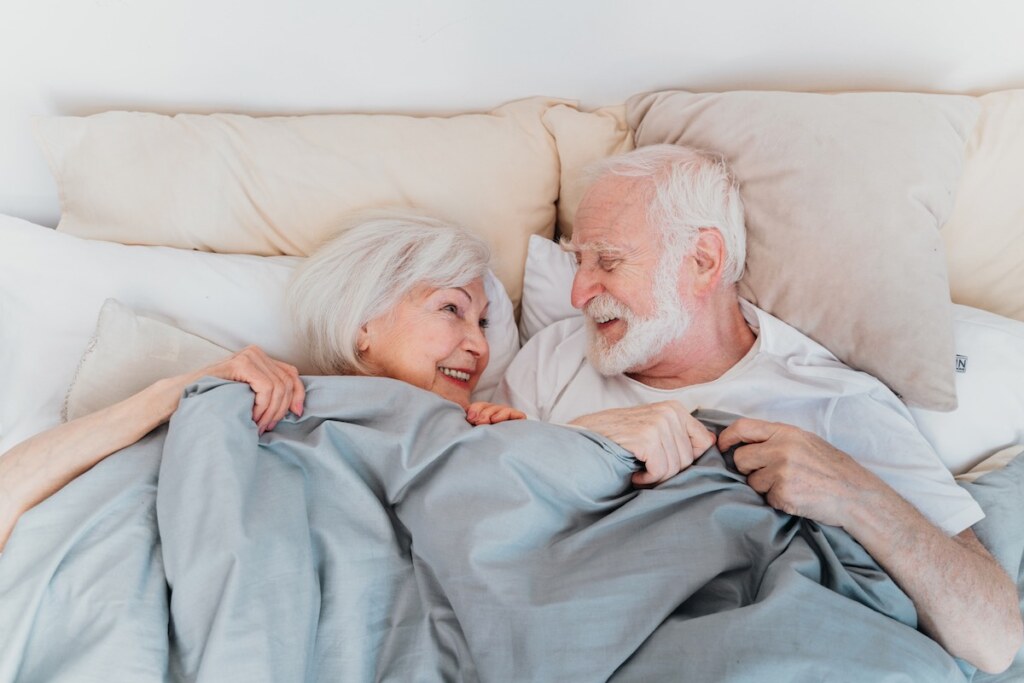 Elderly couple at home on an adjustable bed