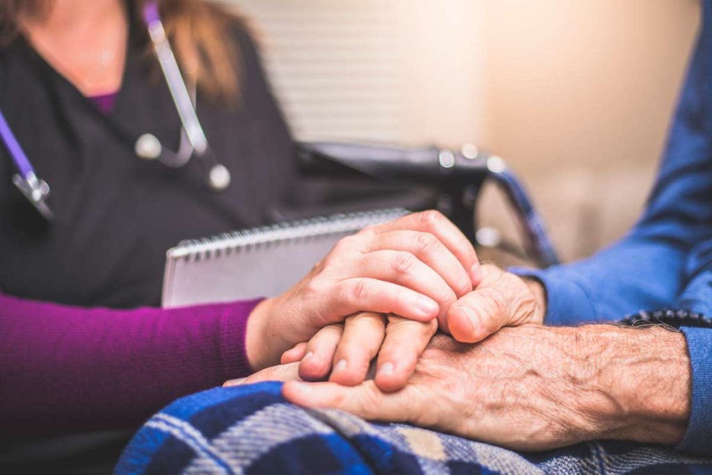 elderly man talking to nurse