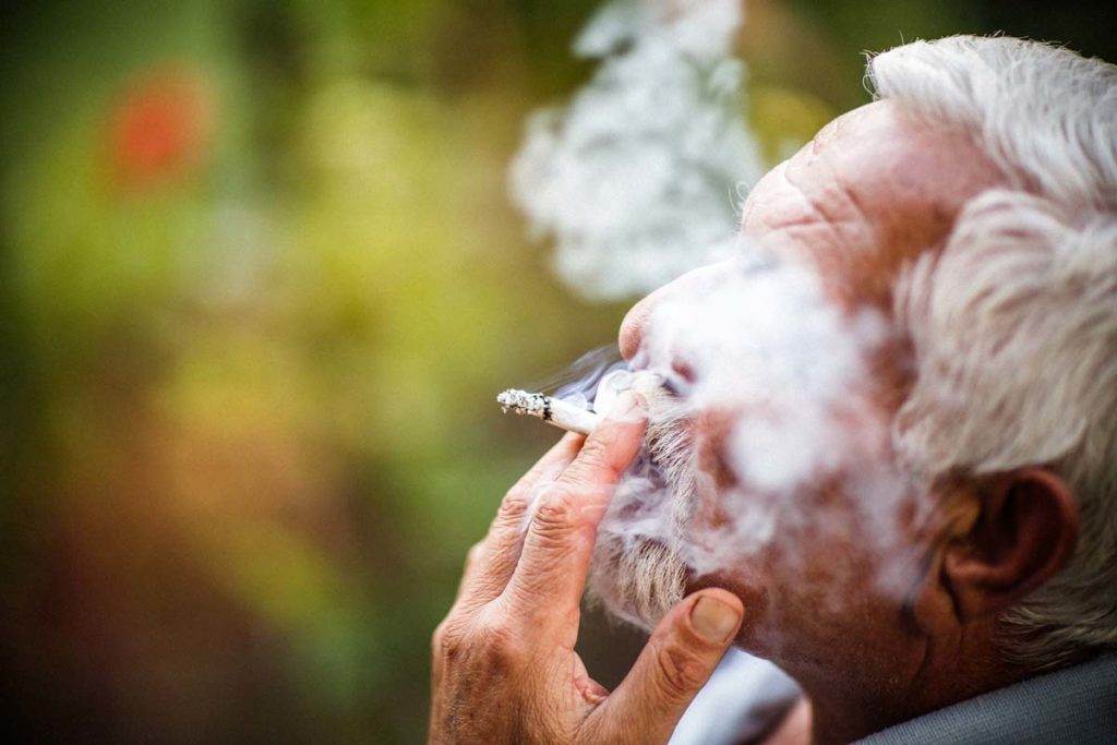 elderly man smoking