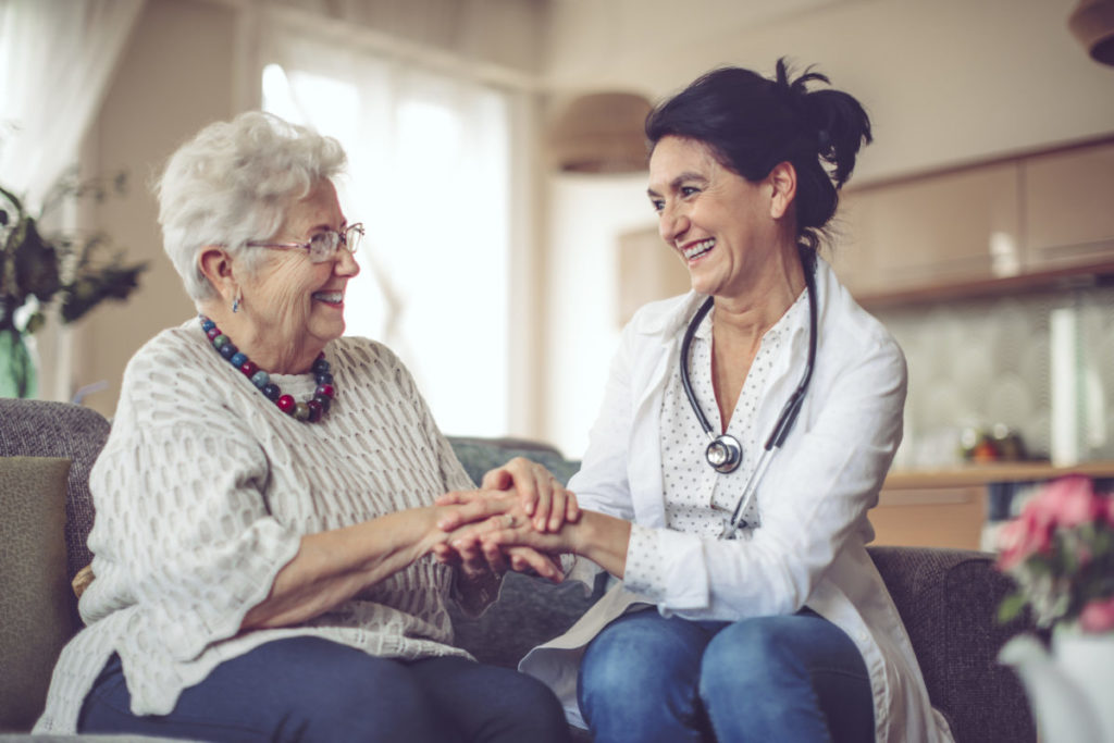 Social worker is visiting a senior woman