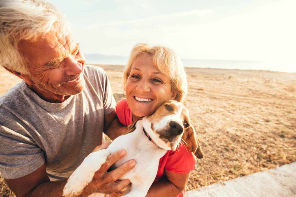 happy couple with dog