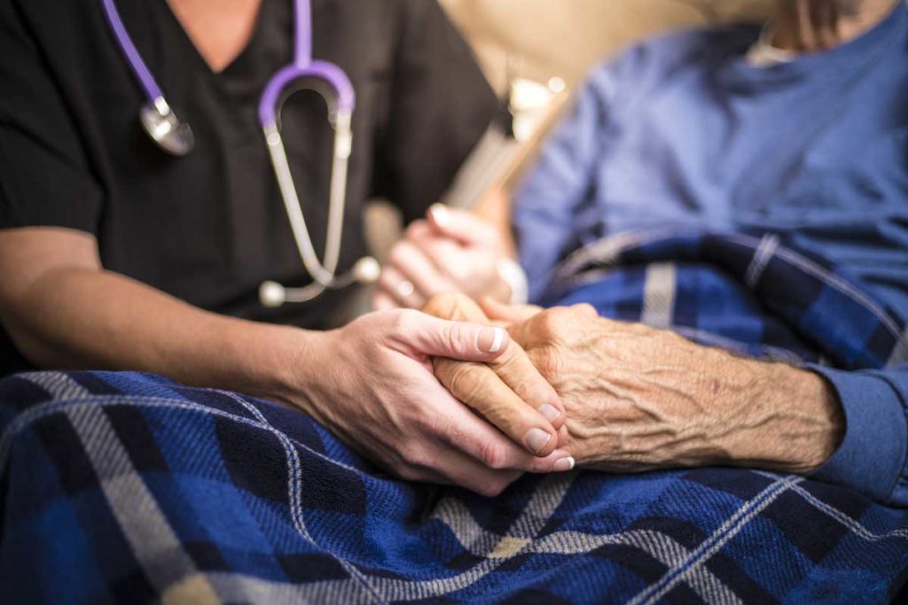 hospice nurse checking on older man