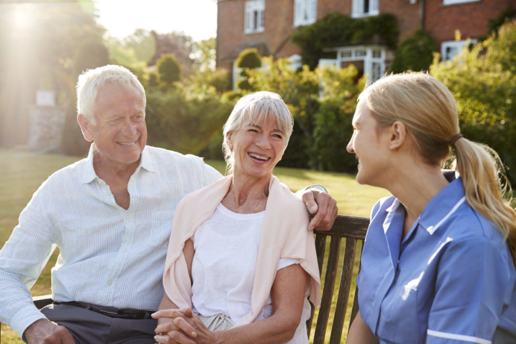 Nurse Talking To Senior Couple