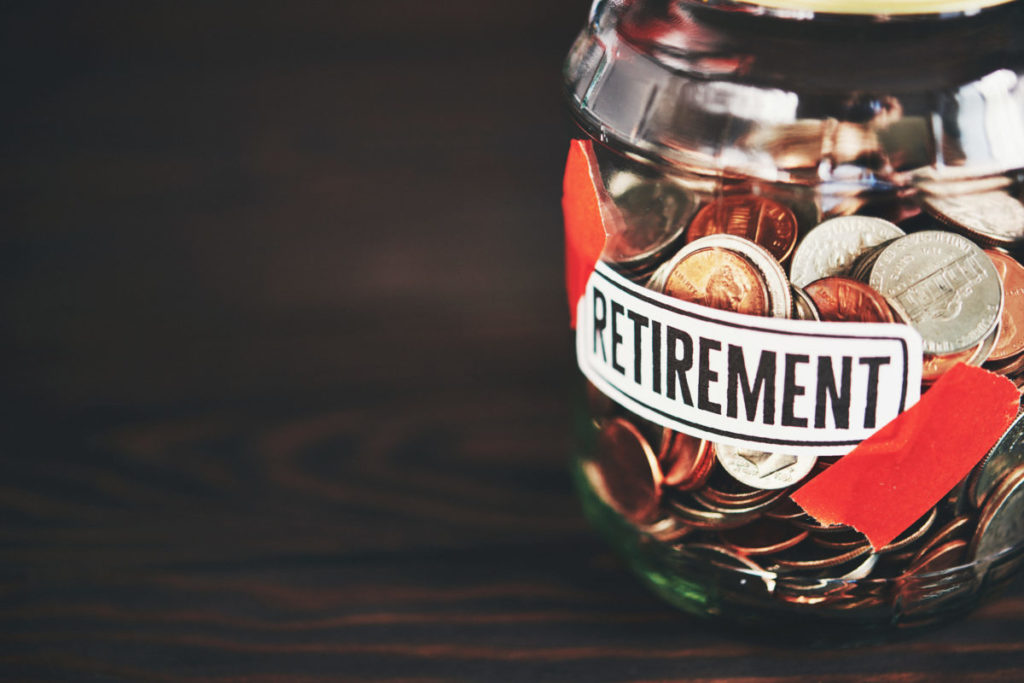 retirement money jar filled with American coins