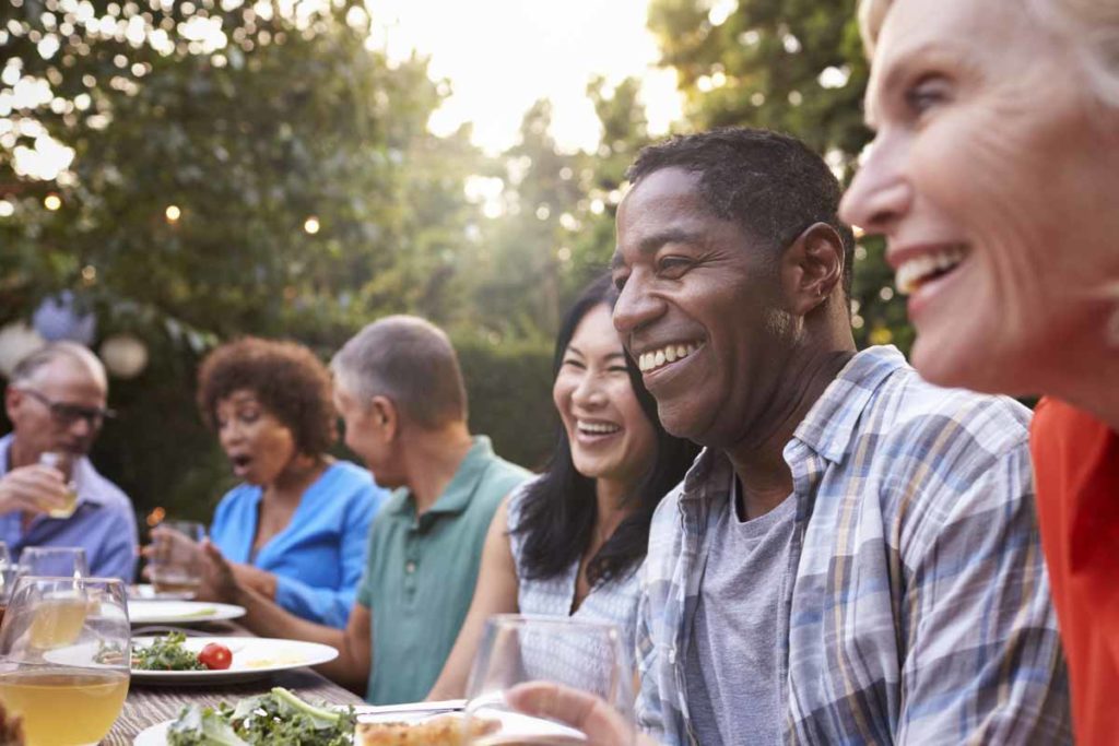 mature adults eating together