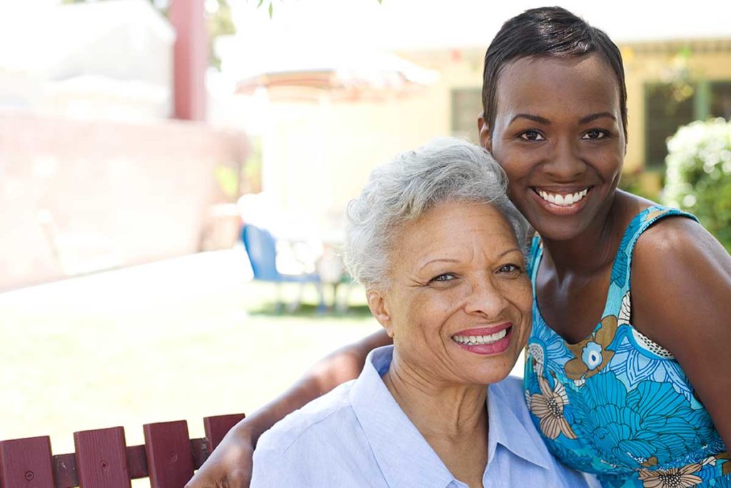 Woman caring for elderly mother