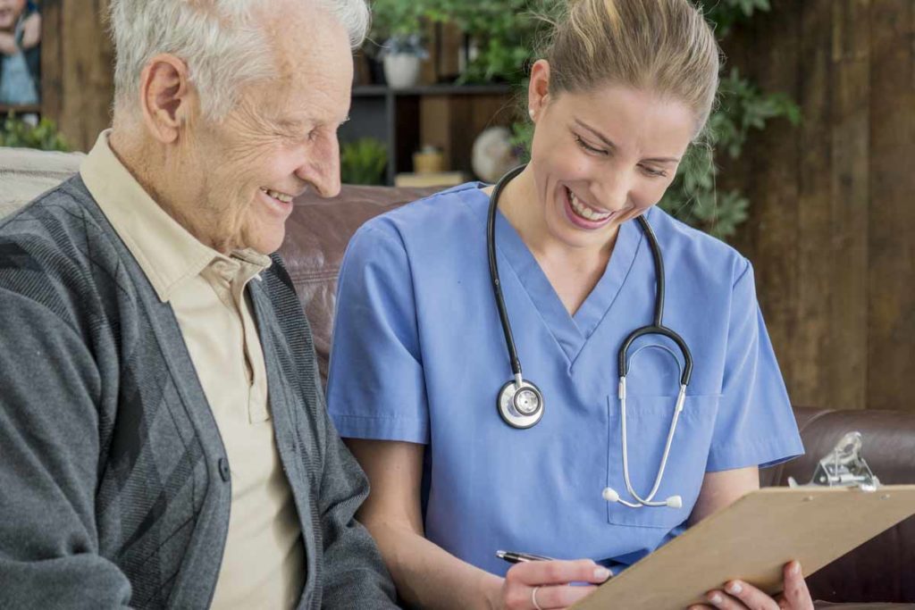 old man talking to nurse