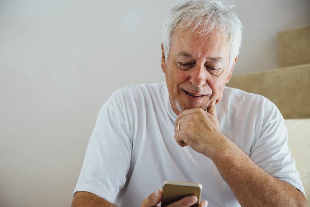 older man checking mobile health