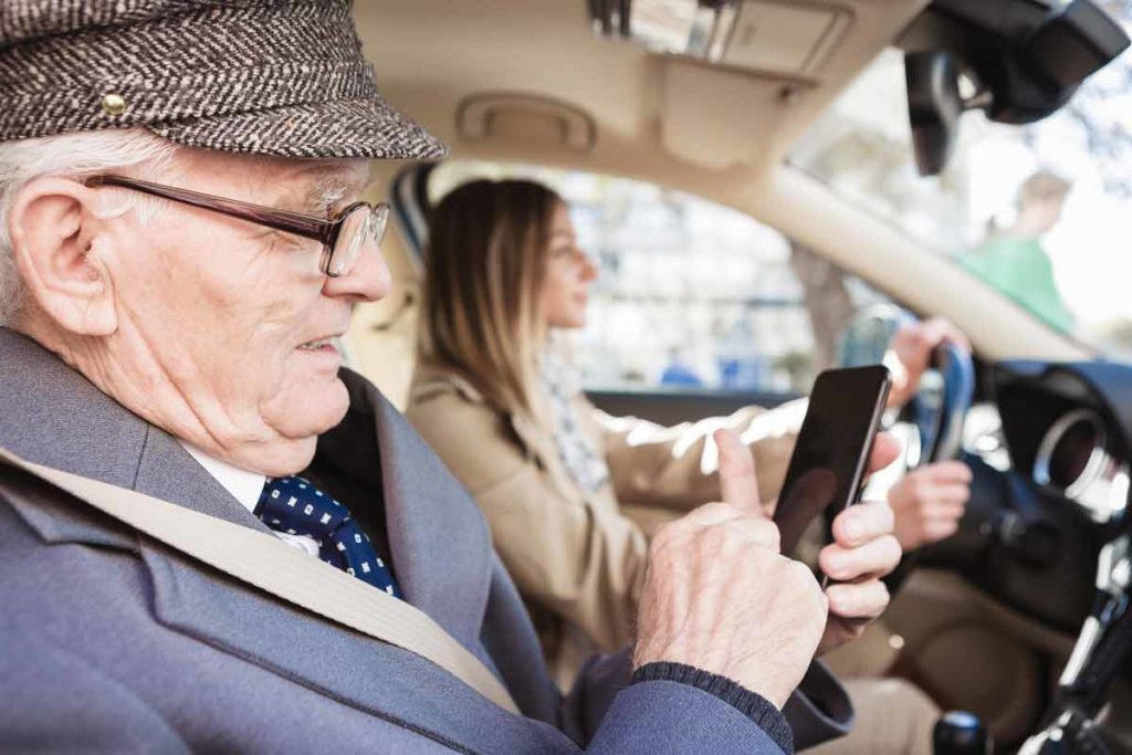 older man getting a ride from a service