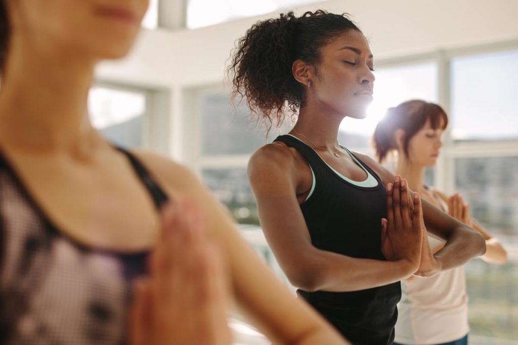 woman doing yoga to take care of herself