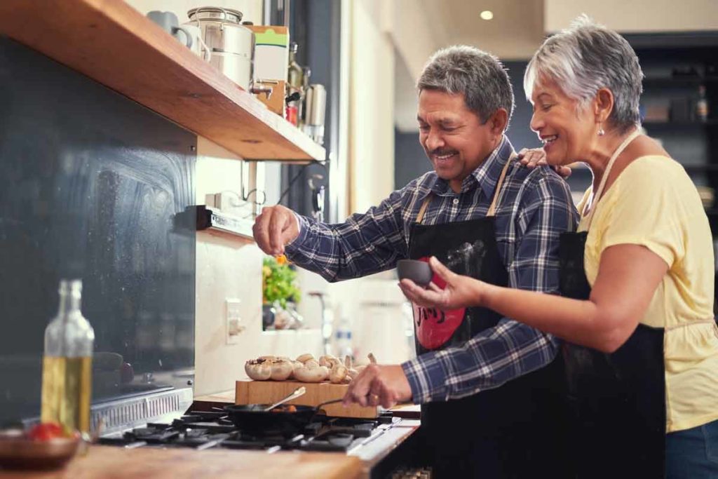 senior couple cooking together