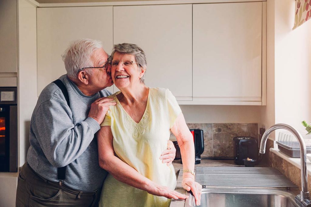 happy senior couple in the kitchen