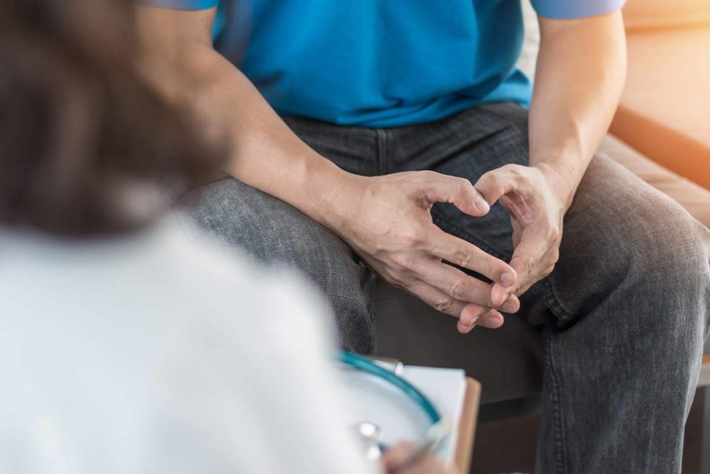 senior man talking to a doctor