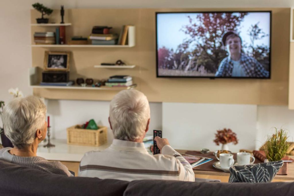 senior elderly watching tv