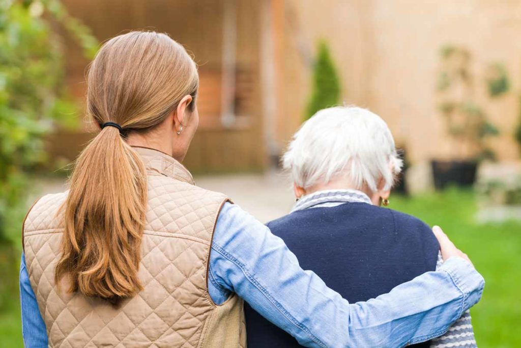 woman helping senior woman