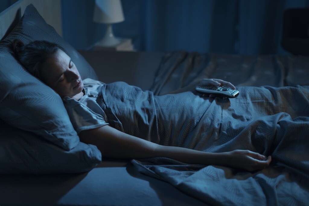 Woman laying on an adjustable bed